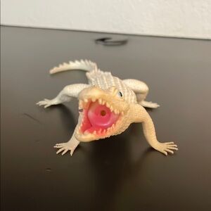White and Pink Alligator Action Figure